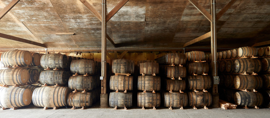 Tenmile Distillery Barrel Room Storage warehouse filled with whiskey barrels.