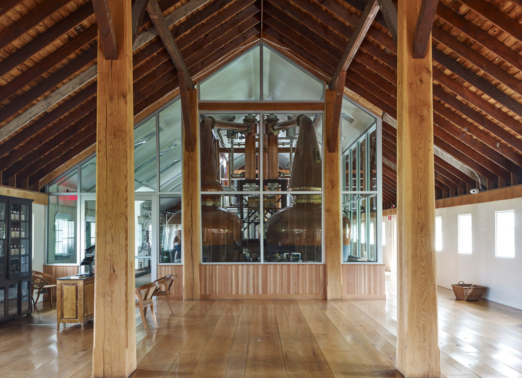 Tenmile Distillery Stills Still room with large glass windows.