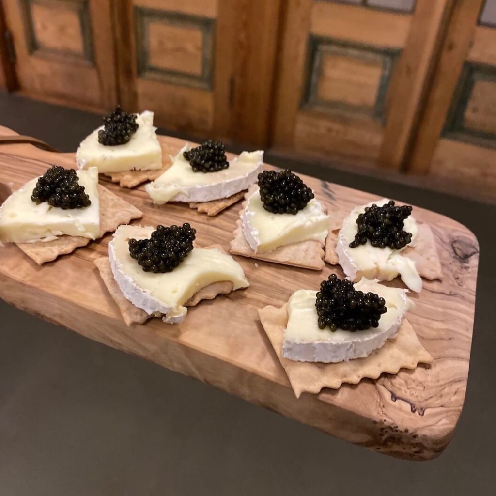 Black River Caviar served with cheese and crackers