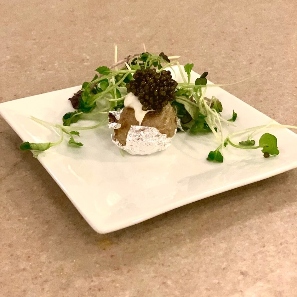 Black River Caviar served with Baked Potatoes and Silver Leaf