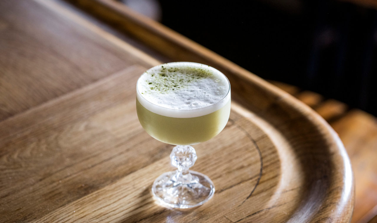 Matcha Sour cocktail on a bar