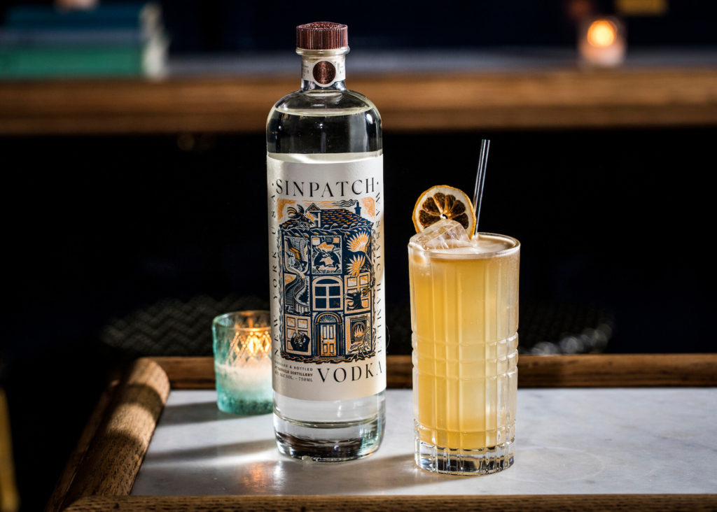 Bottle of Sinpatch Vodka with Sweet Jane Cocktail