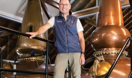 Man standing in front of stills