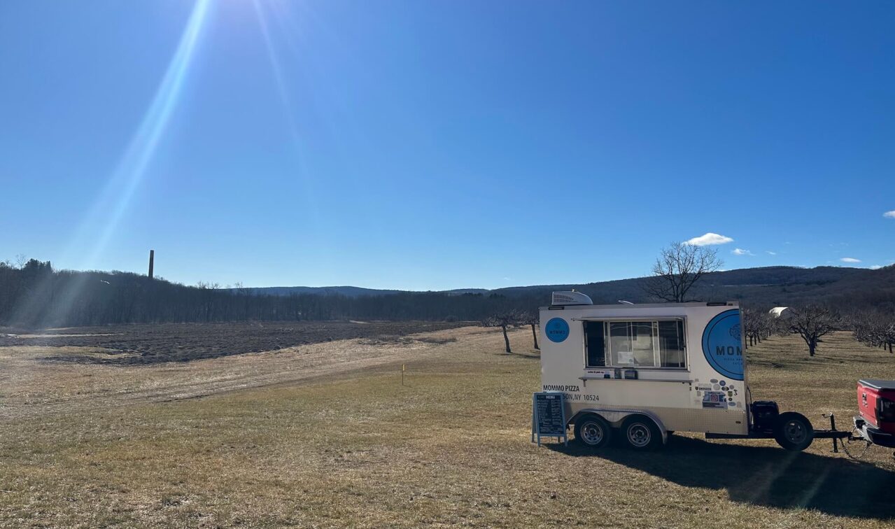 Pizza truck in an orchard